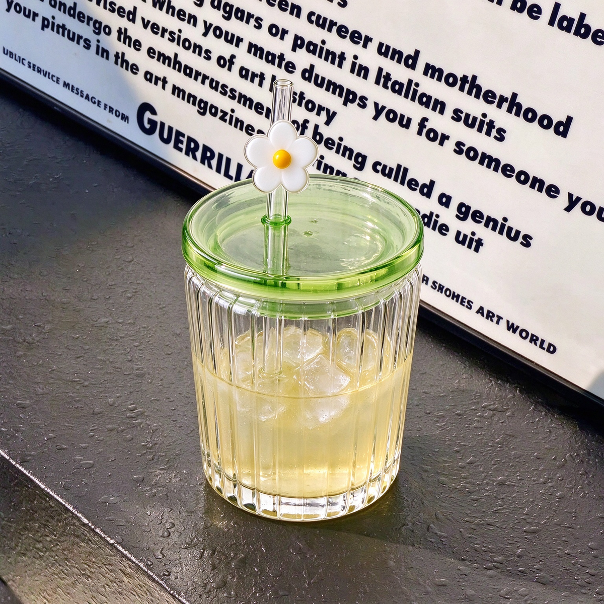 Vertical Ribbed Glass Tumbler With Green Lid And Daisy Straw Topper
